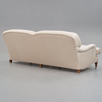 SOFA, "Howard", upholstered in an off-white fabric.