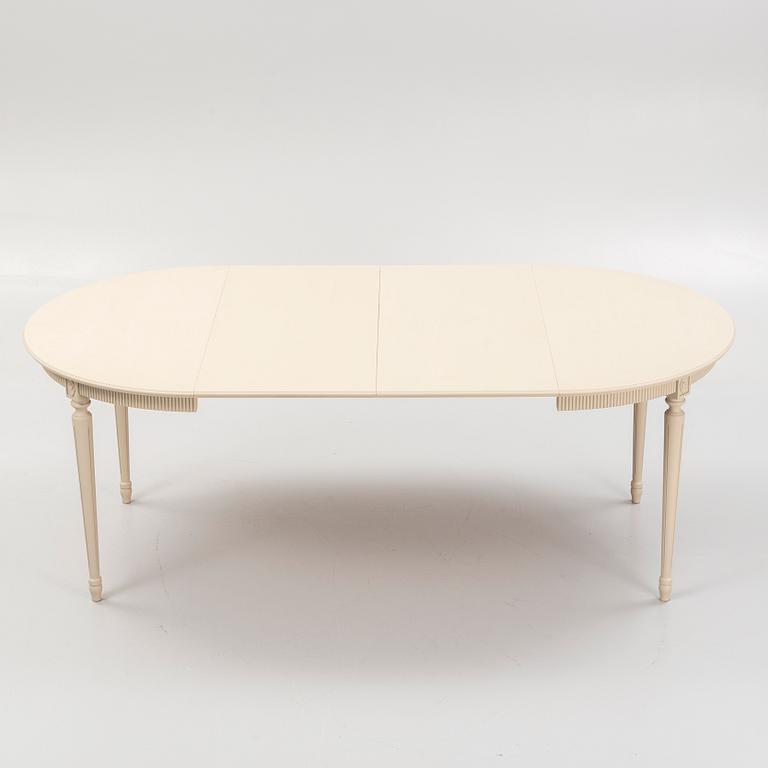 A Gustavian style dining table and eight chairs, late 20th Century.