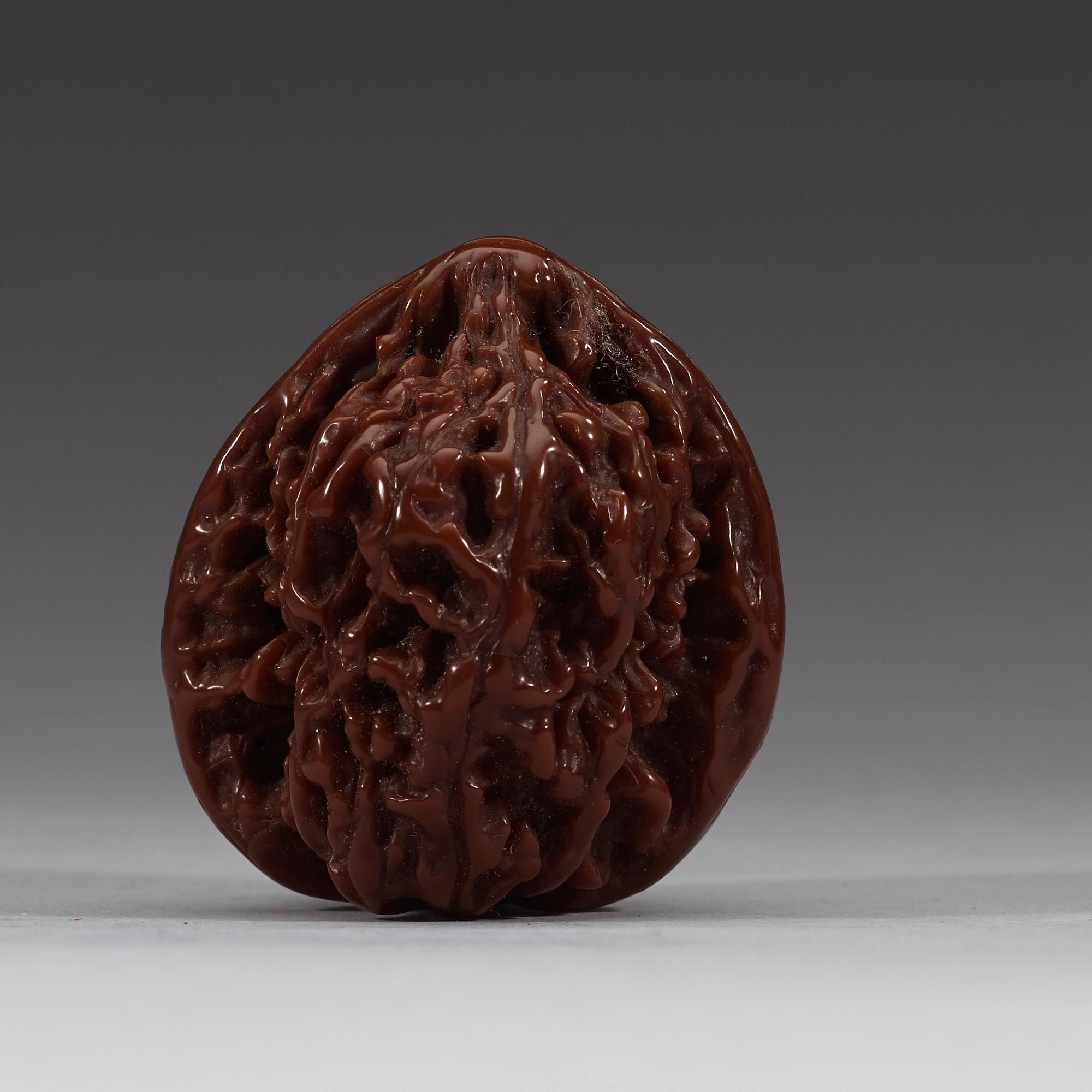 Two pairs of carved walnut hand exercisers, late Qing dynasty (1644-1912).