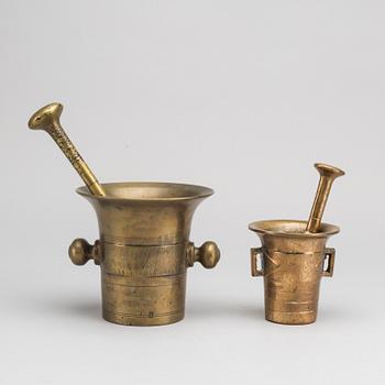 Two brass mortar and pestle.