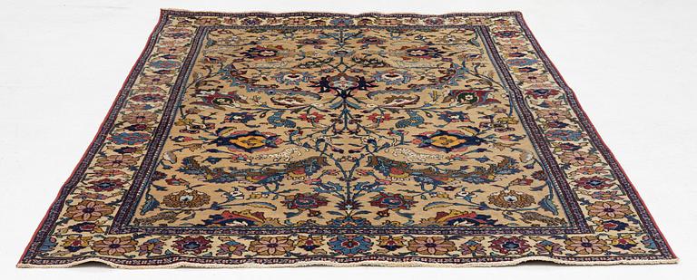 A semi-antique Tabriz of  'Sickle-Leaf' design, c 240 x 161 cm.