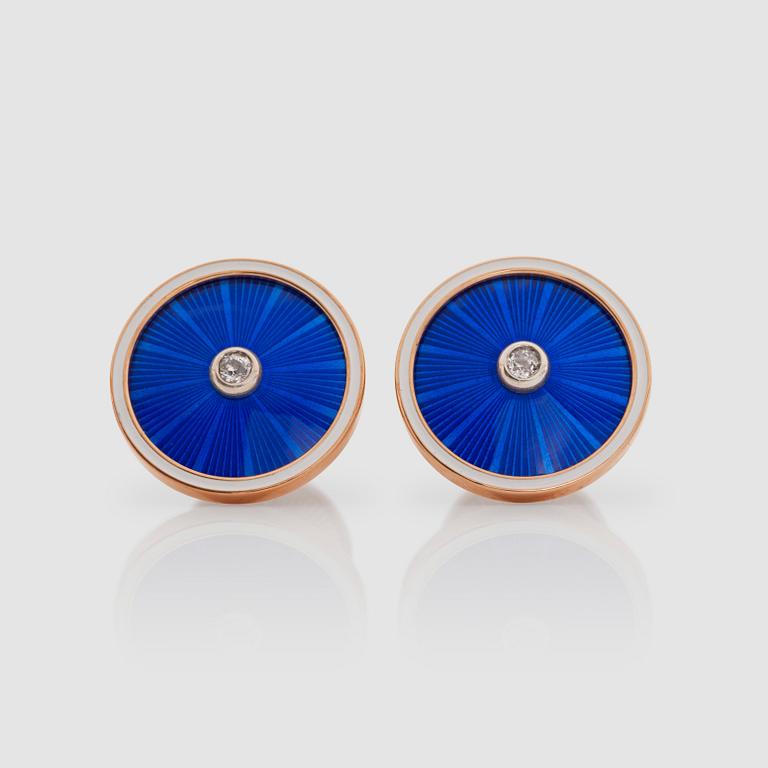 A pair of brilliant-cut diamond and blue enamel cufflinks. Total carat weight of diamonds circa 0.14 ct.