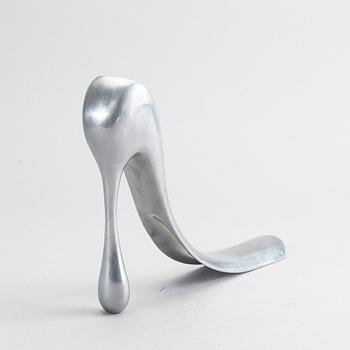 A metal shoe horn by Manolo Blahnik.