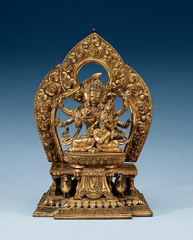 1700. A large gilt bronze Nepal/Sino-Tibetan figure of Buddha, Qing dynasty, presumably Qianlong (1736-95). With an inscription around the base.