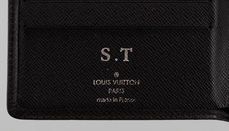 LOUIS VUITTON, black taiga leather wallet.