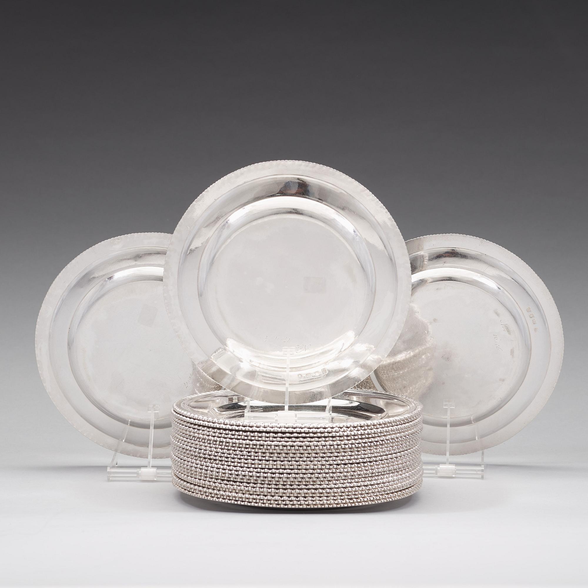 A set of 24 English mid 18th century silver plates, mark of George Methuen, London 1756.