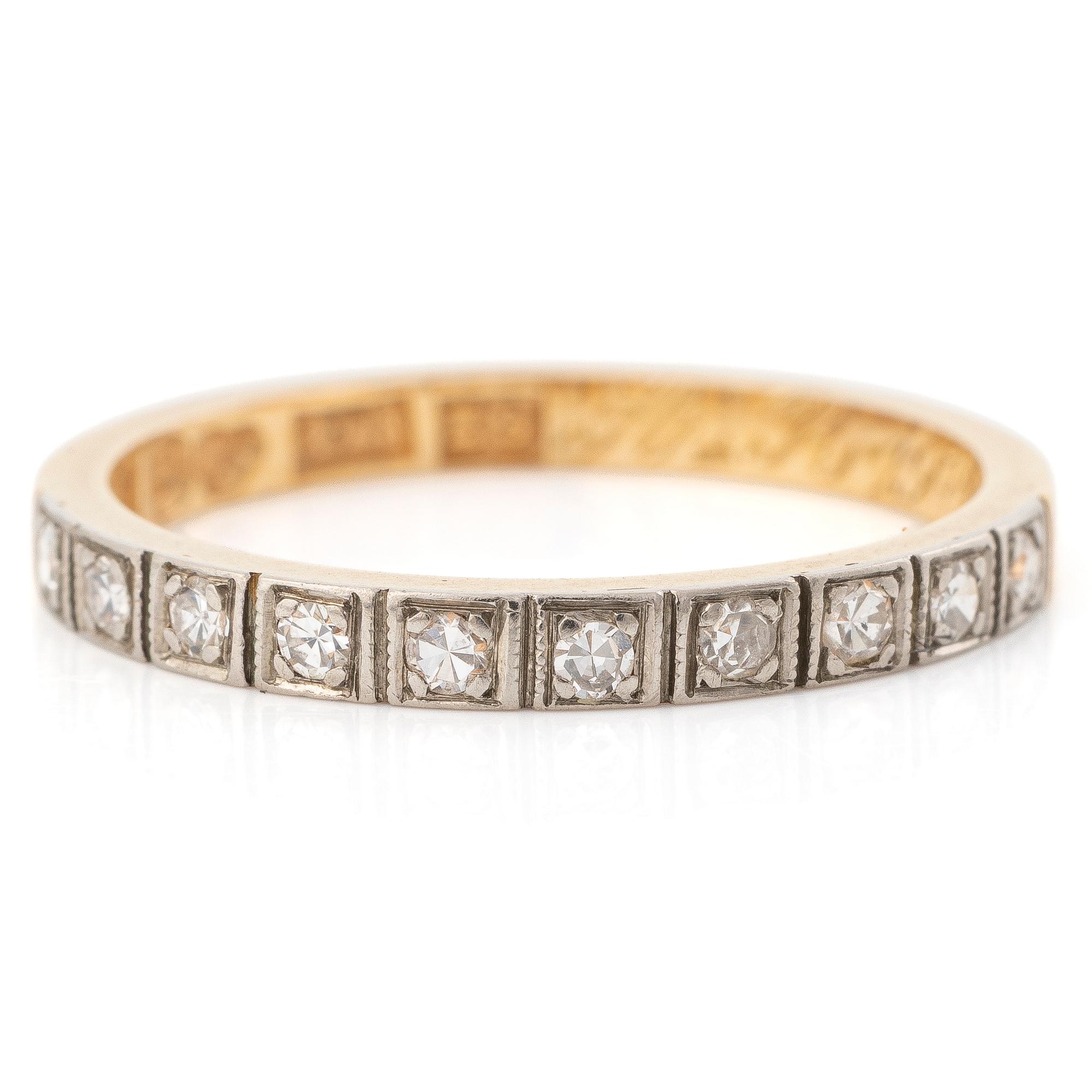 18K gold half-eternity ring with octagonal-cut diamonds.