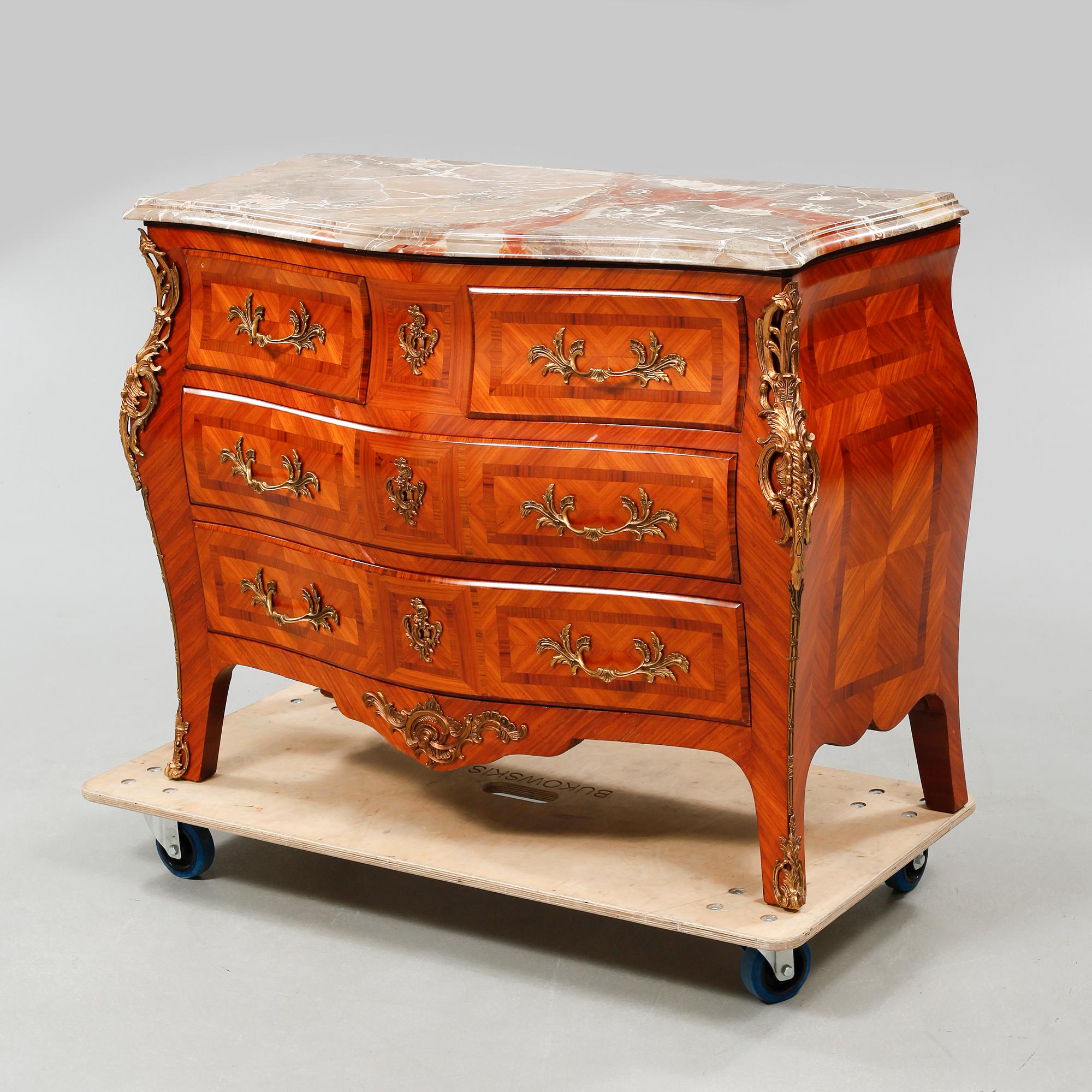A rococo style chest of drawers, around the mid 20th century.