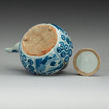 A blue and white Japanese tea pot with cover.