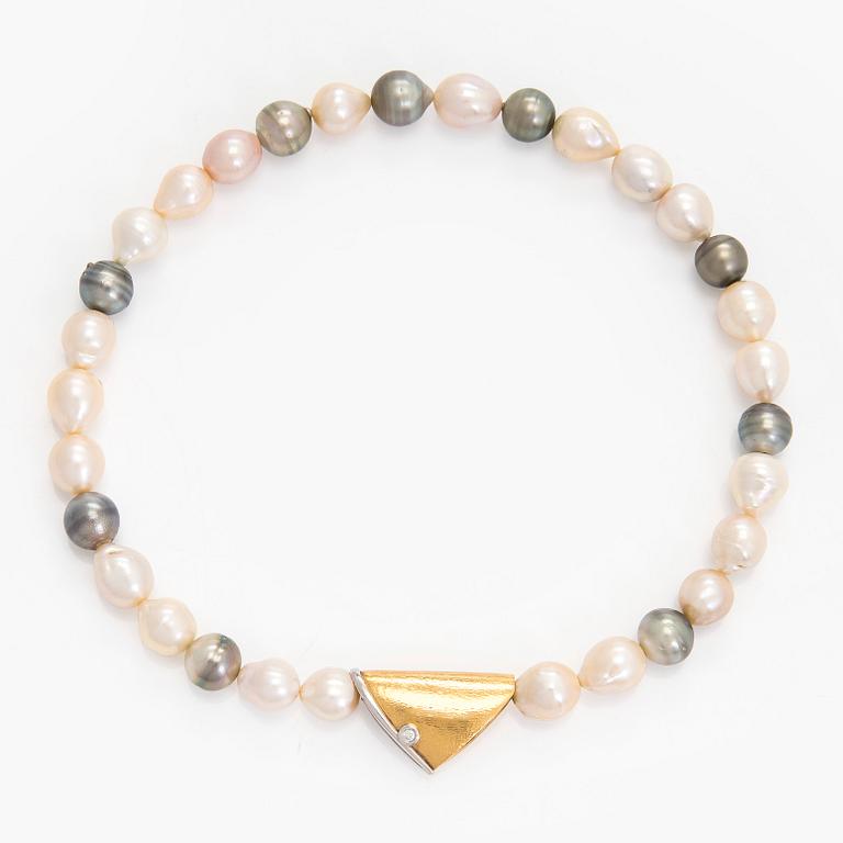Ole Lynggaard, A cultured pearl necklace, clasp in 18K gold with a round brilliant-cut diamond.