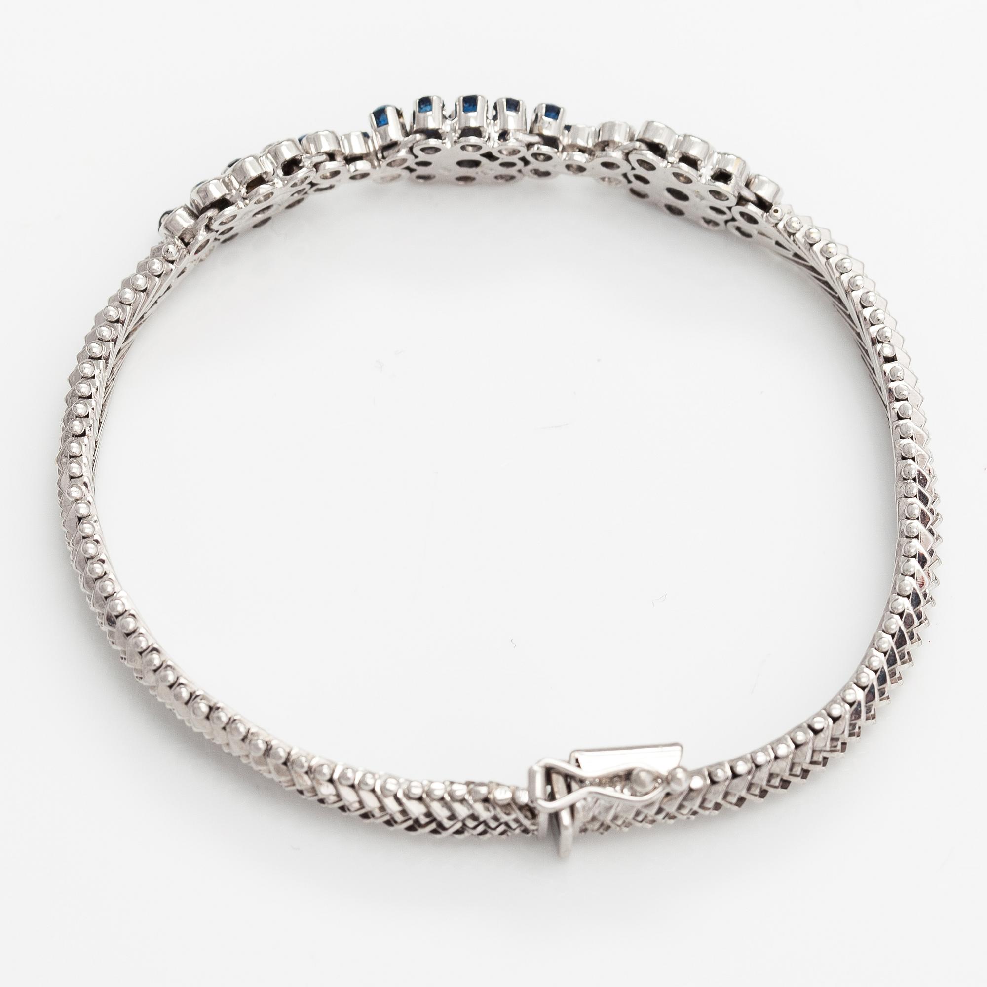 Rannekoru, 18K valkokultaa, safiireja ja timantteja n. 0.18 ct yht.