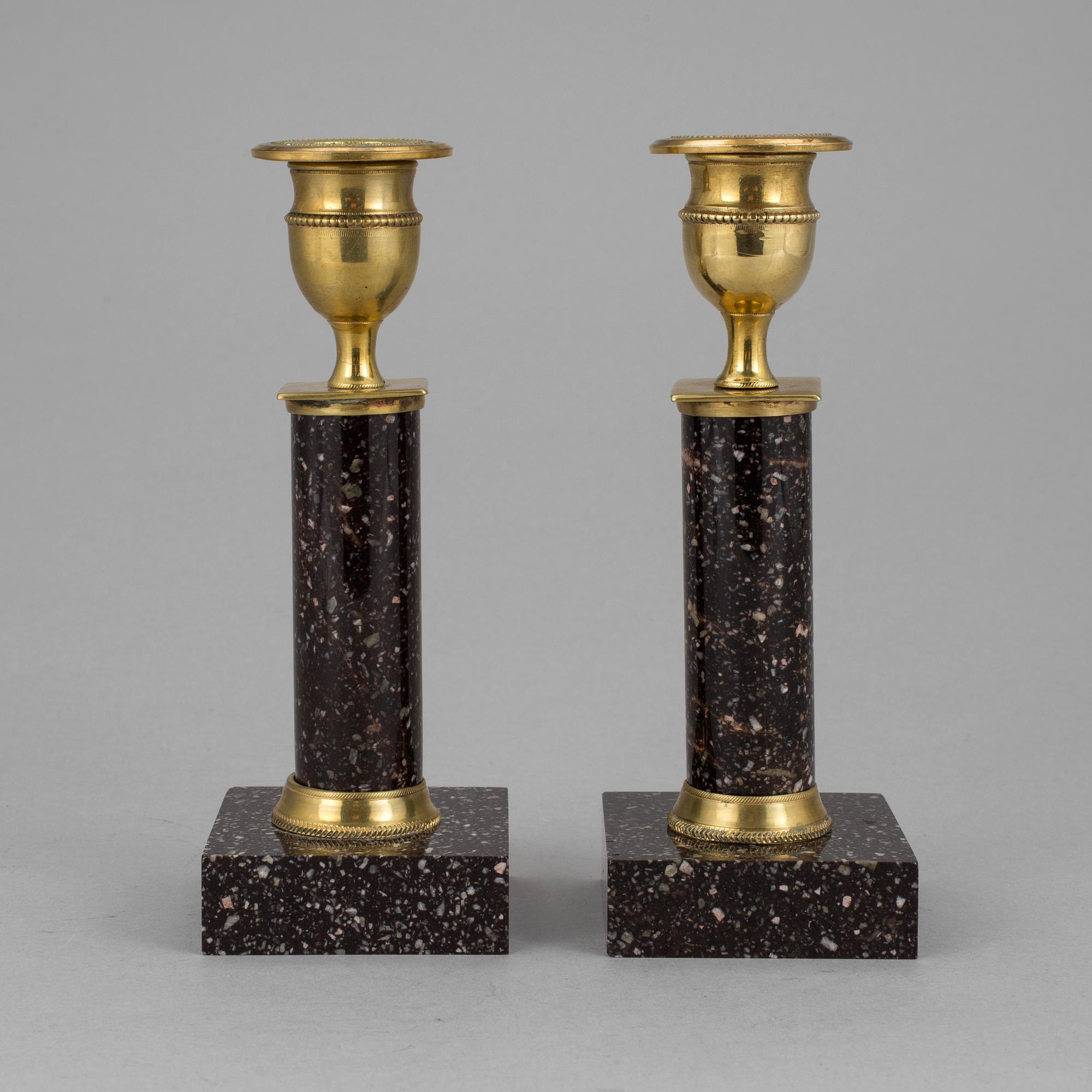 A pair of late gustavian porphyry candle sticks early 19th century.