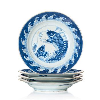 1102. A set of four blue and white dishes with leaping carp, Qing dynasty, Kangxi (1662-1722).