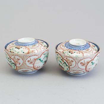 A pair of Japanese early 20th century porcelain bowls with covers.