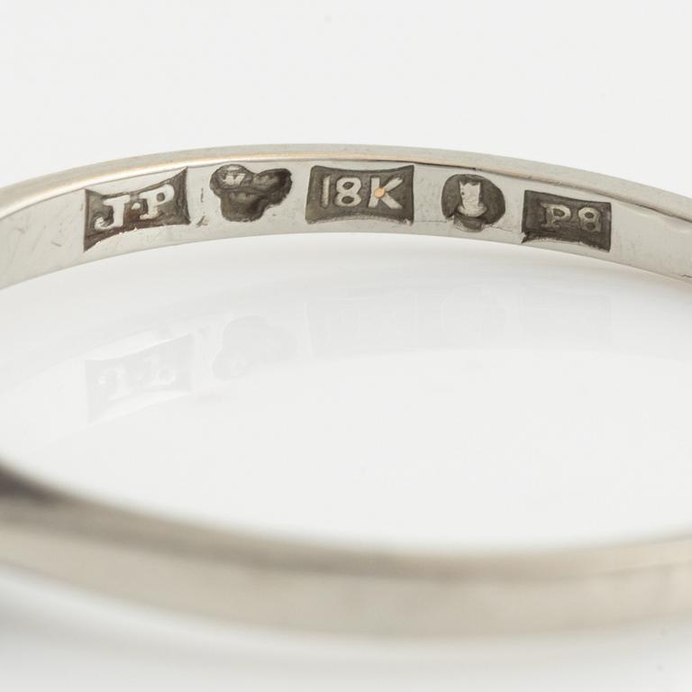 White gold and three brilliant cut diamond ring.
