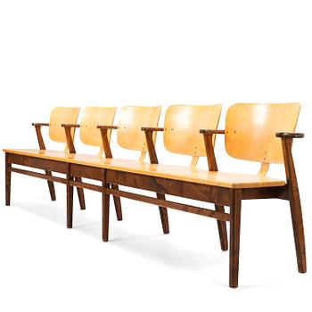 ILMARI TAPIOVAARA, An early 1950s five-seater 'Domus' bench row.