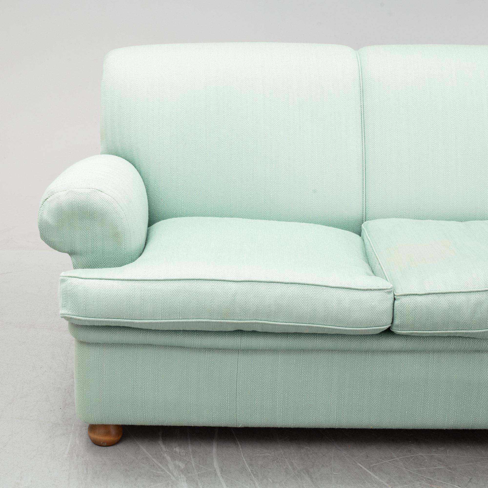 A model 703 sofa by Josef Frank for Firma Svenskt Tenn.