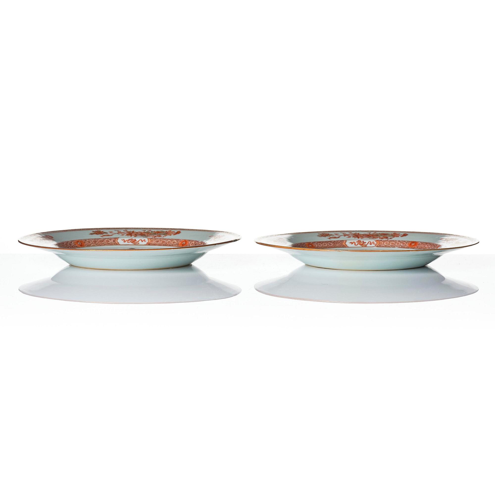 A pair of iron red decorated armorial dishes, Qing dynasty, 18th century.