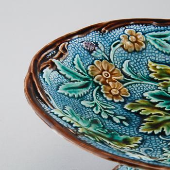 Eighteen majolica small plates and a serving dish from Rörstrand, second half of the 19th century.