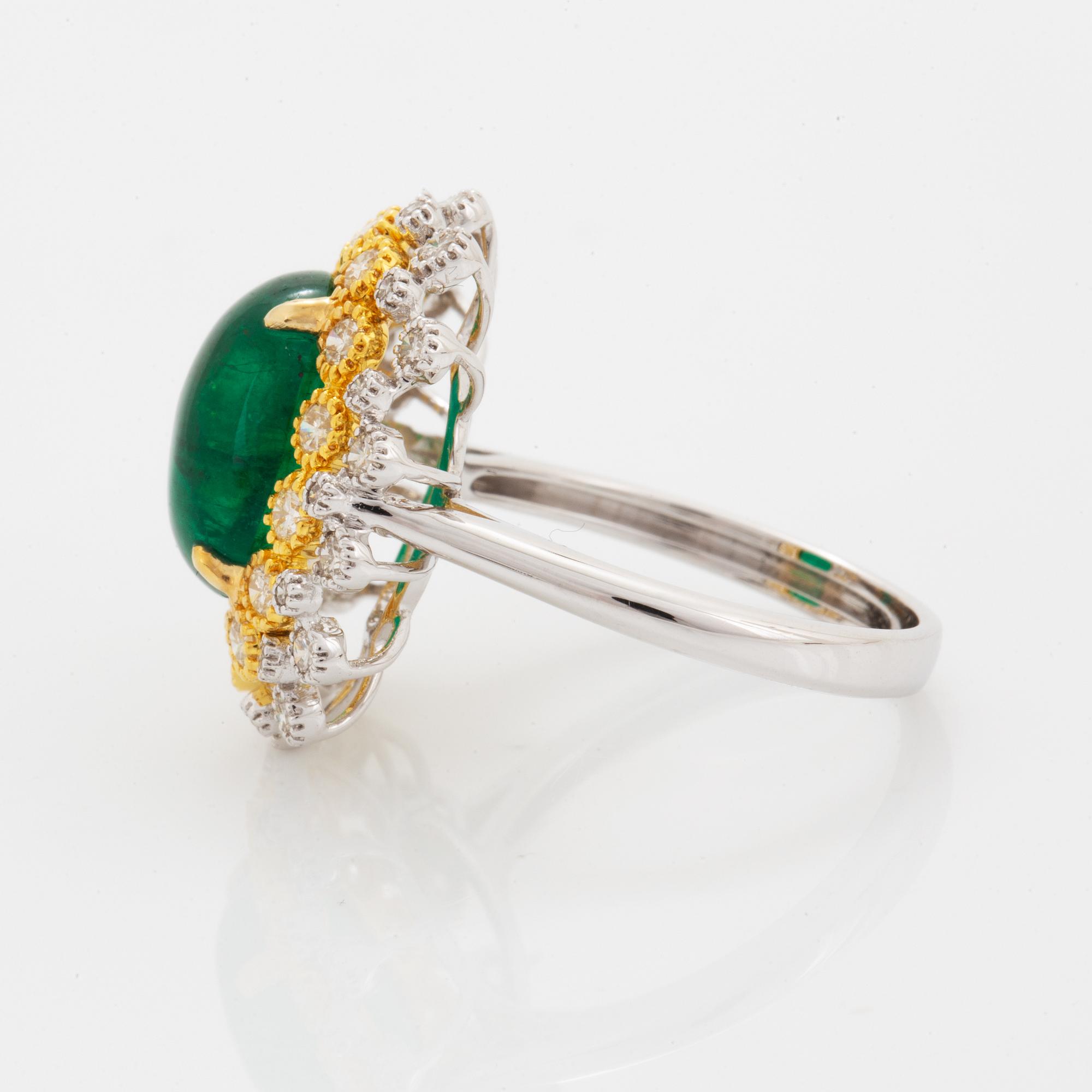 Cabochon-cut emerald and brilliant-cut diamond ring.