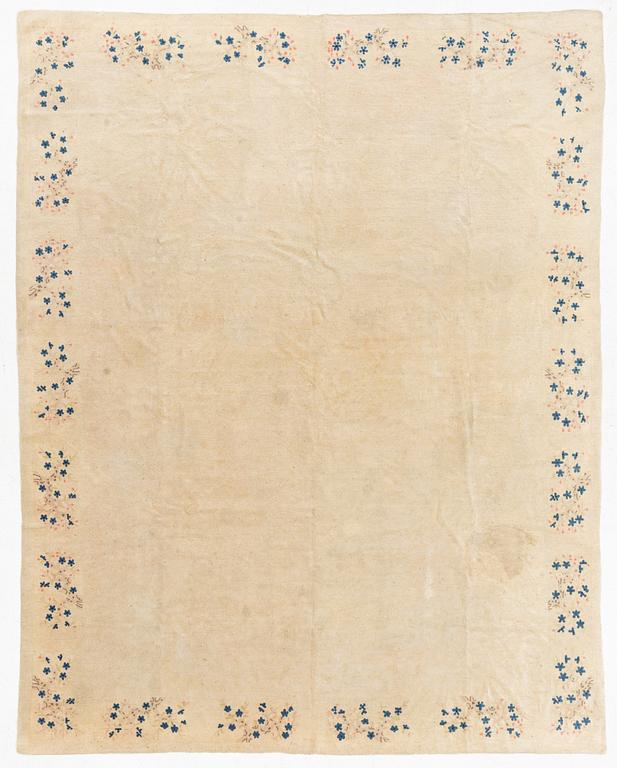 An Antique Peking rug, northern China, c 344 x 240 cm.