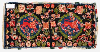A cushion, 'Red Lion' (Rött Lejon), tapestry weave, c. 104 x 47 cm, Southwestern Scania, first part of the 19th century.
