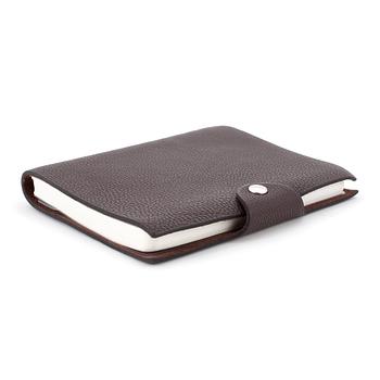 446. HERMÈS, a brown leather notebook, "Ulysse Petit Modèle".