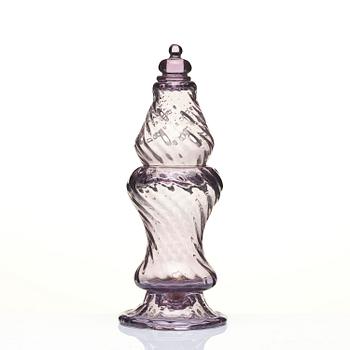 An amethyst coloured suger shaker and a cut glass goblet, 18th century.