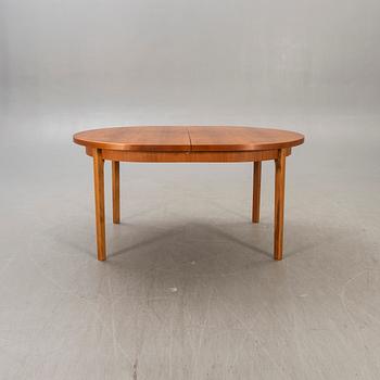 A 1960s teak dining table.