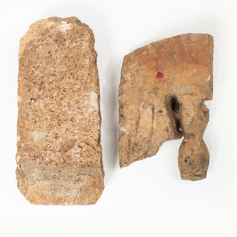 Two Indian stone fragments, 19th century or older.
