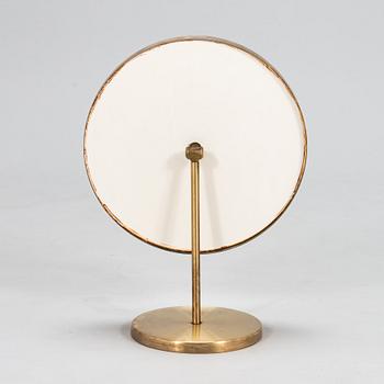 A brass table mirror, Glas Mäster, Markaryd, Sweden.