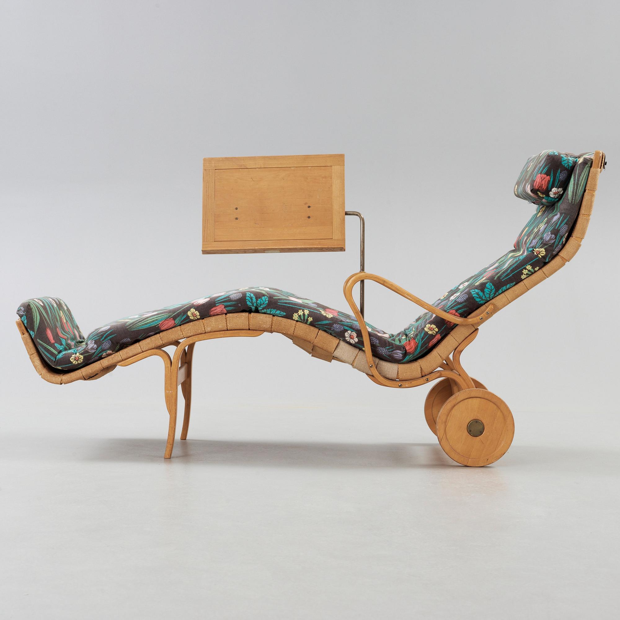 A Bruno Mathsson Swedish Modern chair with attached reading table, Karl Mathsson, Värnamo 1944.