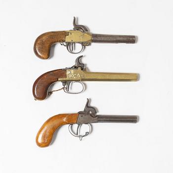 Three percussion pistols, 19th century.