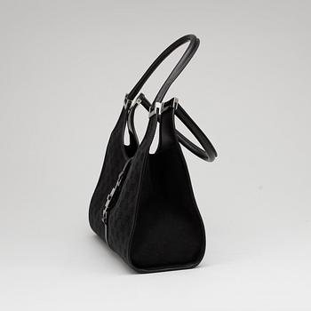 GUCCI, a black monogram canvas shoulder bag, "Jackie".