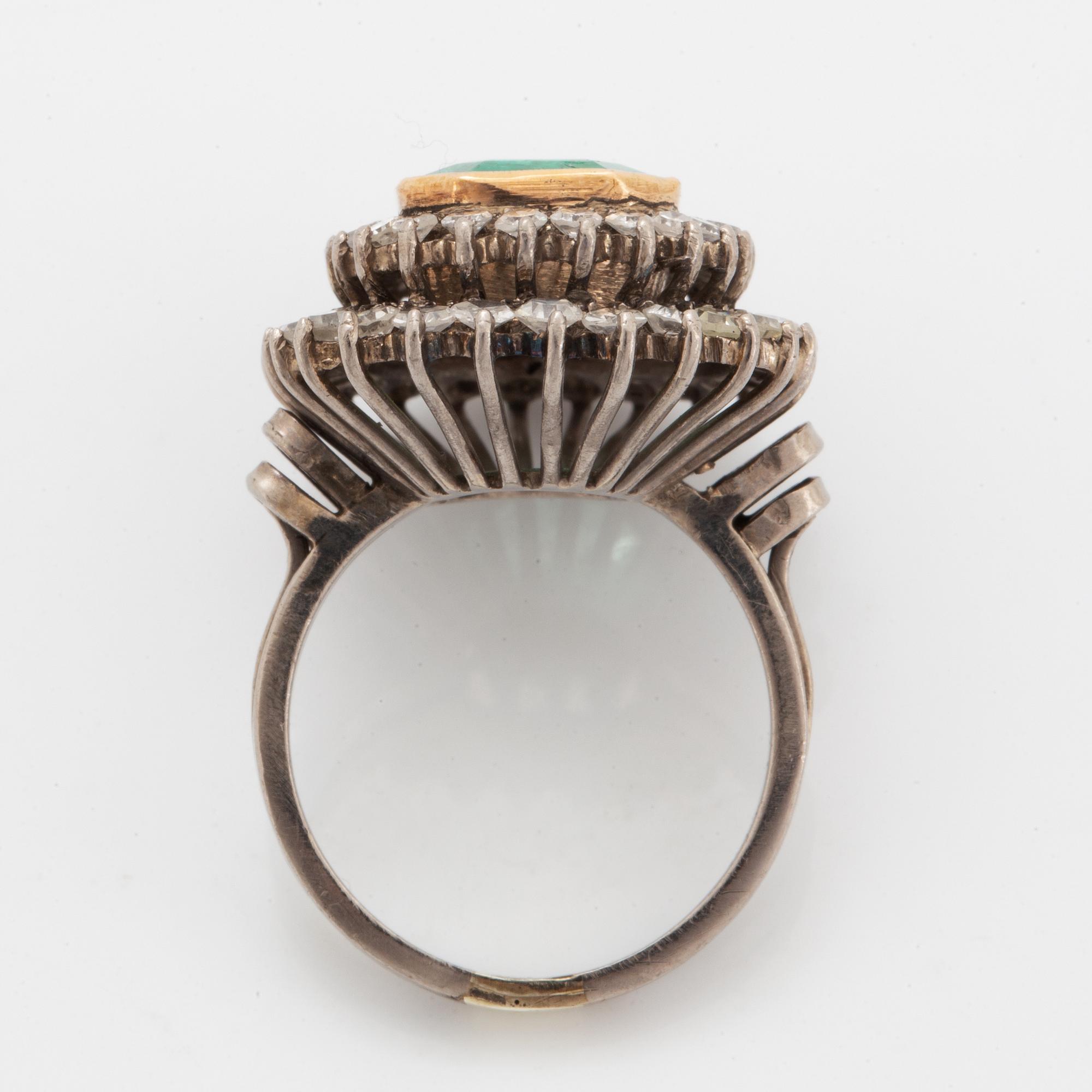 Emerald-cut emerald and eight-cut diamond ring.