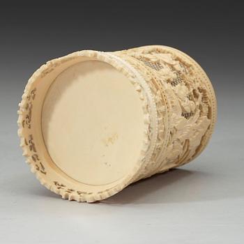 An exquisitely carved and pierced ivory brush pot, Qing dynasty, 19th century.