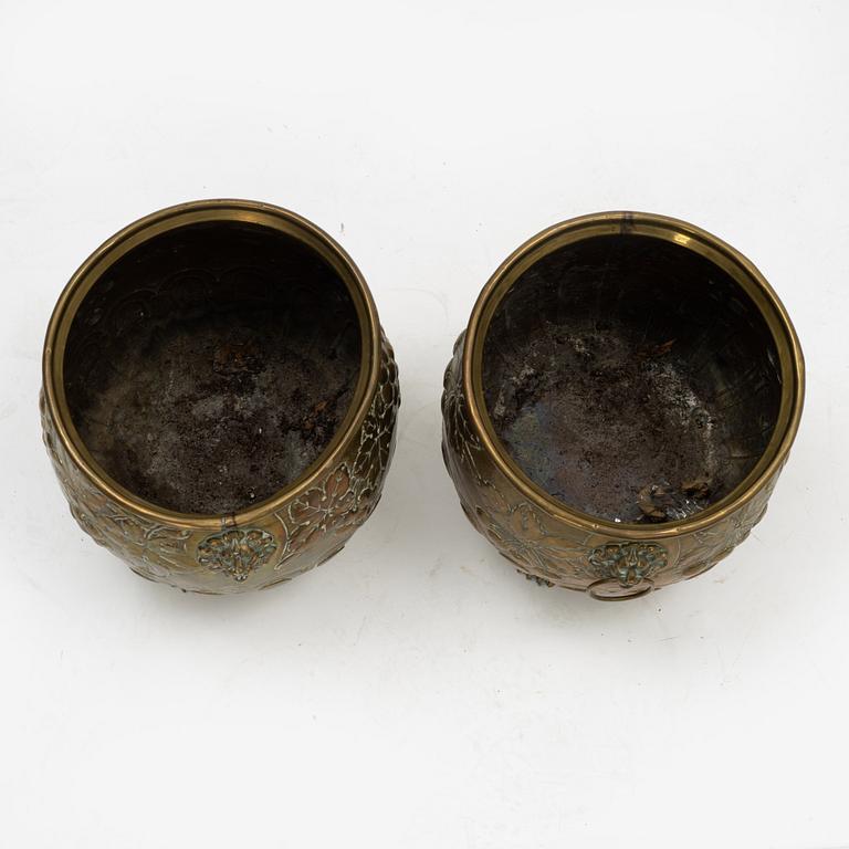 A pair of Baroque style brass plant pots, late 19th Century.