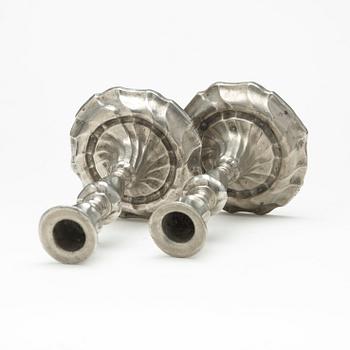 A pair of Swedish Rococo pewter candlesticks by L Lundwall 1762.