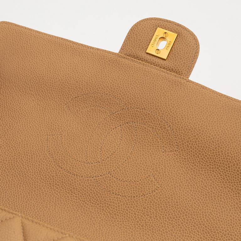 Chanel, a beige caviar leather bag, 1996-1997.