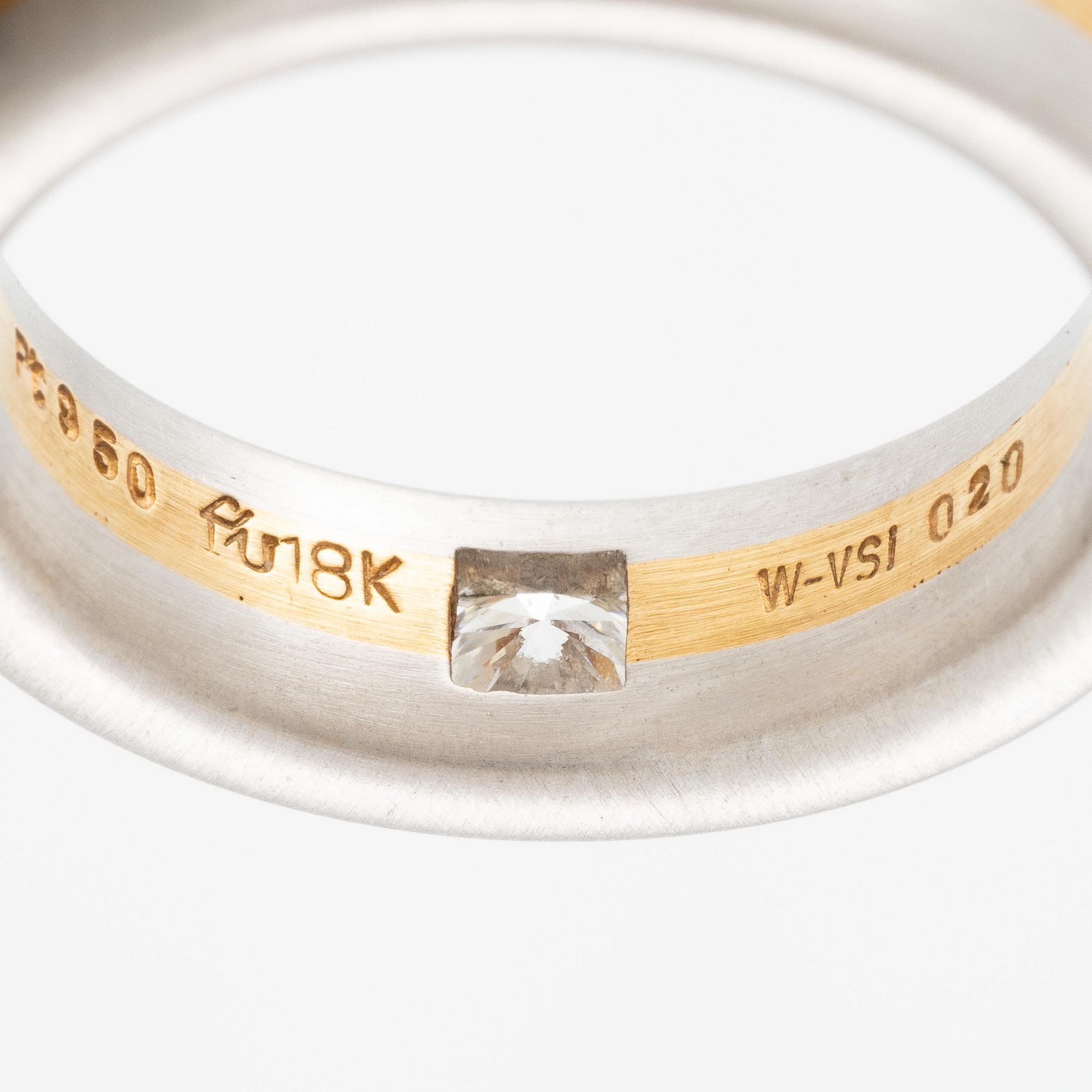 Ring in platinum and 18K gold set with a brilliant-cut diamond.