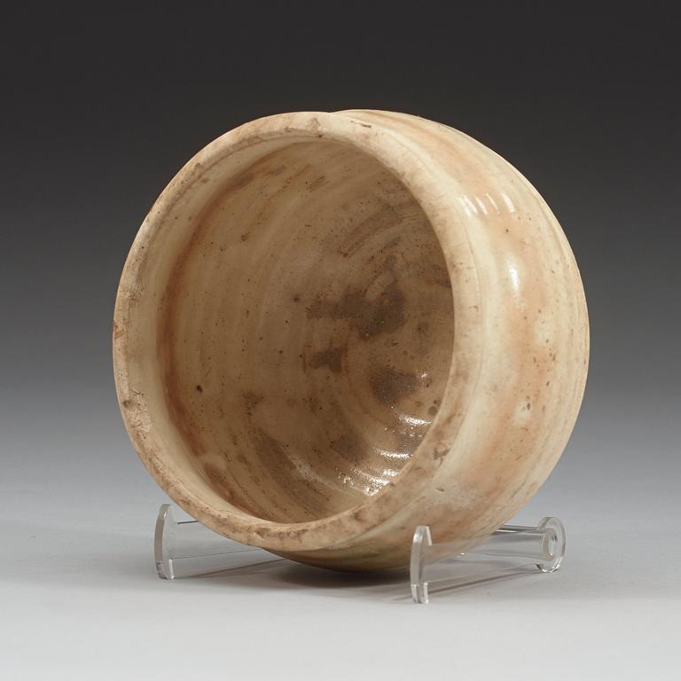 A white glazed pottery bowl, Tang dynasty (618-907).
