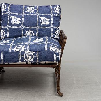 A contemporary bamboo imitating garden sofa.