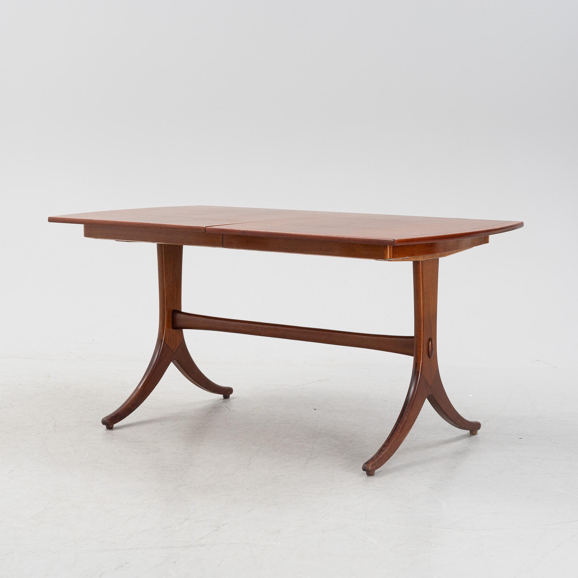 A mahogany and rosewood veneered dining table, mid 20th Century.