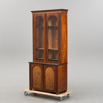 A walnut veneered book cabinet, late 19th Century.