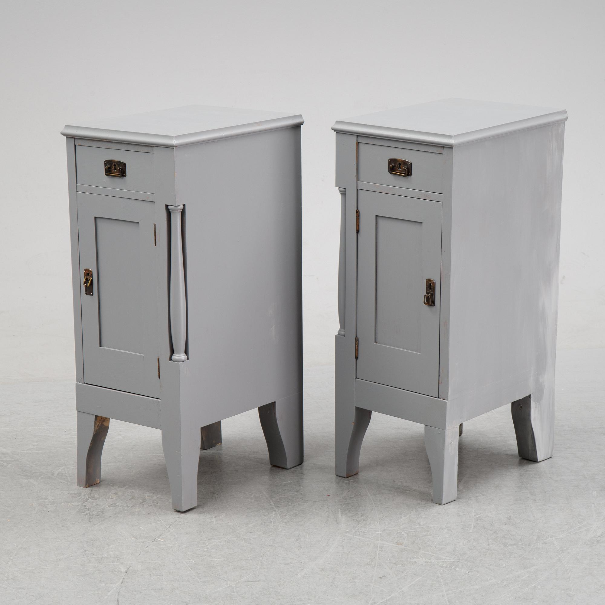 A pair of painted bedside tables stands. First half of the 20th century.