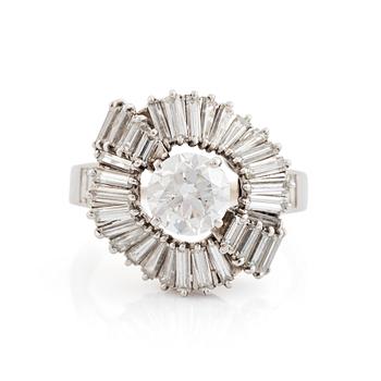 411. A Boucheron platinum ring set with a round brilliant-cut diamond weight ca 1.25 cts quality ca H vvs.