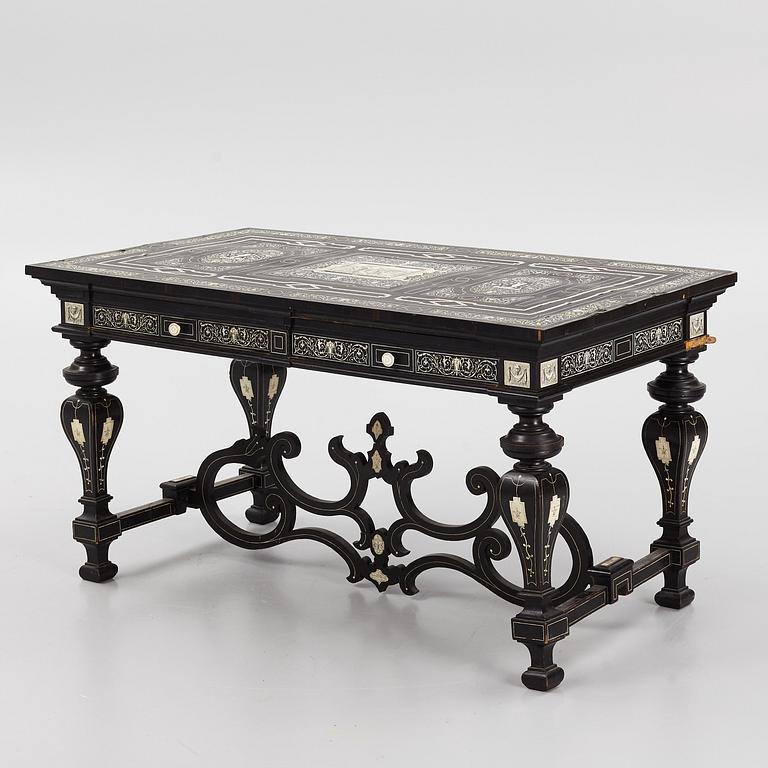 A Renaissance-style ebony, ebonized and ivory-inlaid library table, late 19th century, presumably Germany.