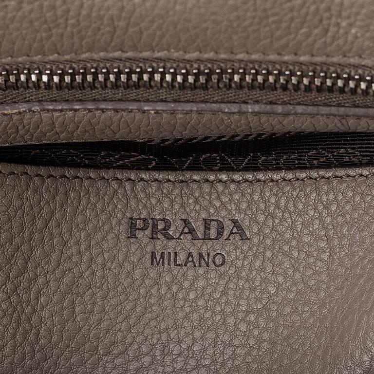 Prada, a leather handbag.