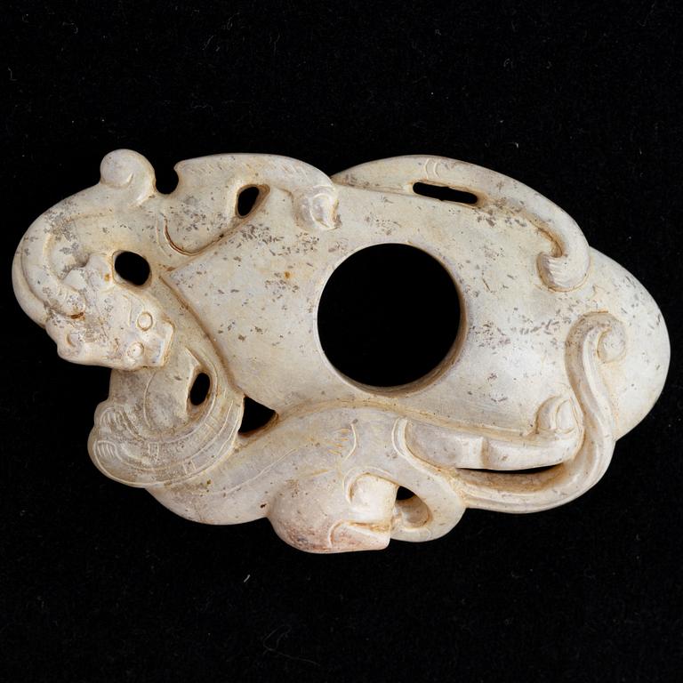 An archaistically carved nephrite sculpture, China, 20th Century.