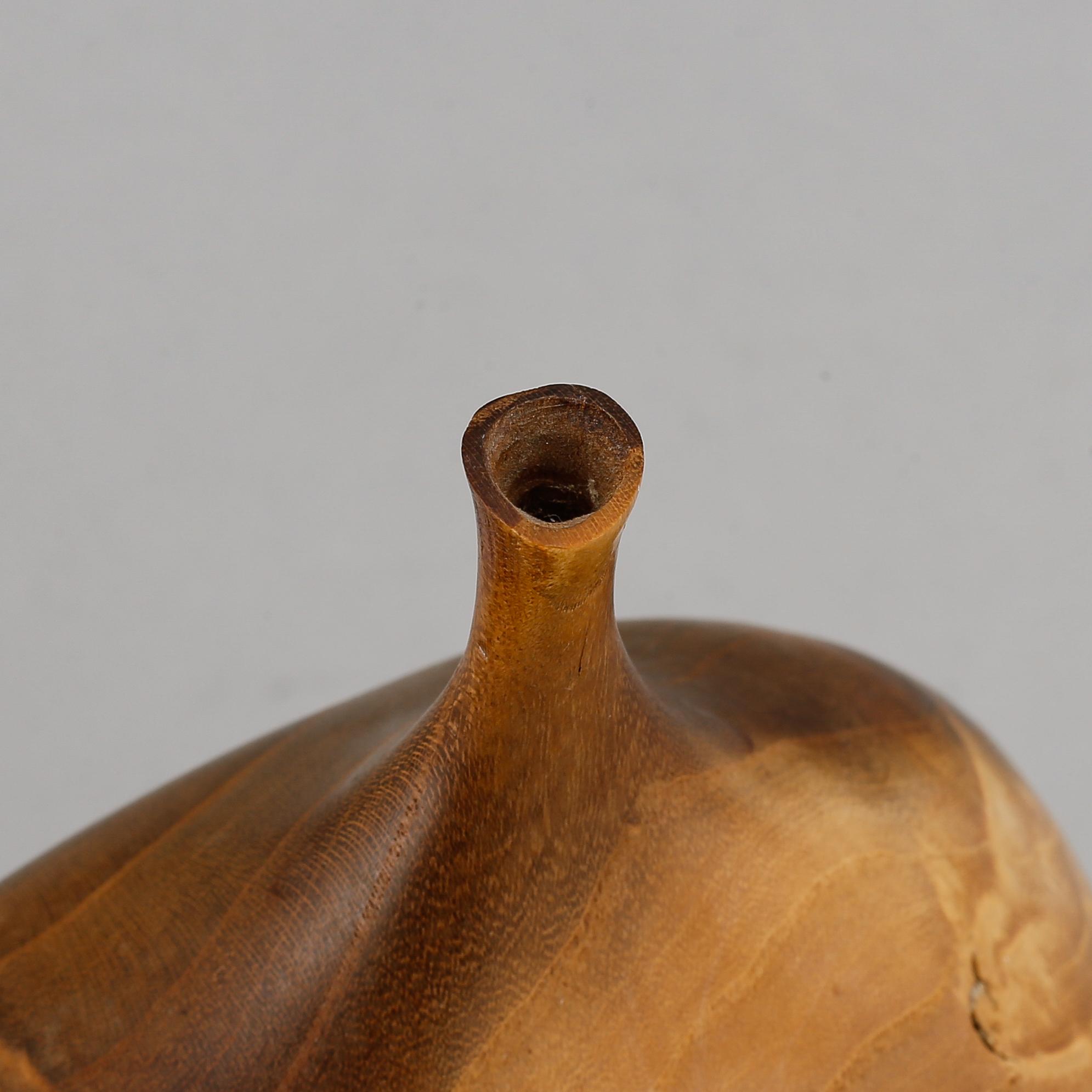 Doug Ayers, Orange wood bottle, signed.